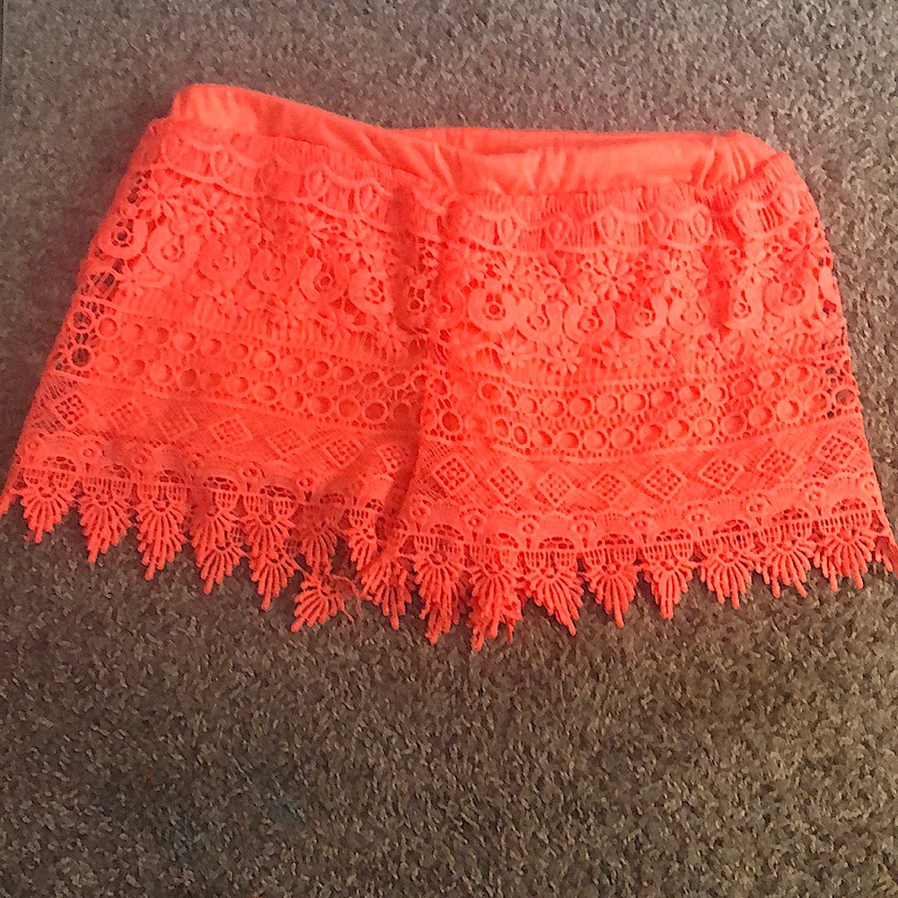 A used self esteem pair of shorts and is a large and made of 100% polyester